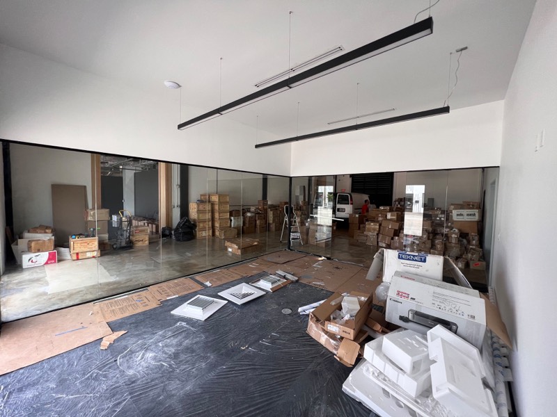 Wide view of a glass partition wall during a commercial build-out