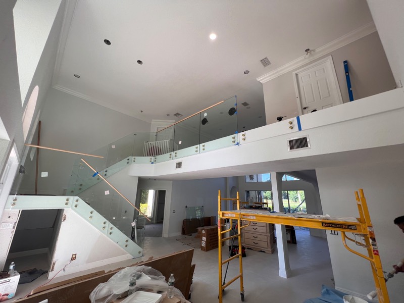 Balcony and stair glass railing partly installed