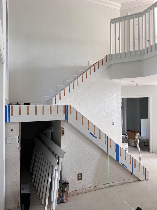 Standoff positions marked along the stairs before drilling