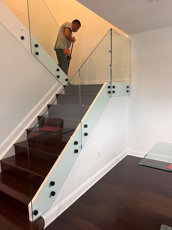 Glass railing panels going onto the staircase