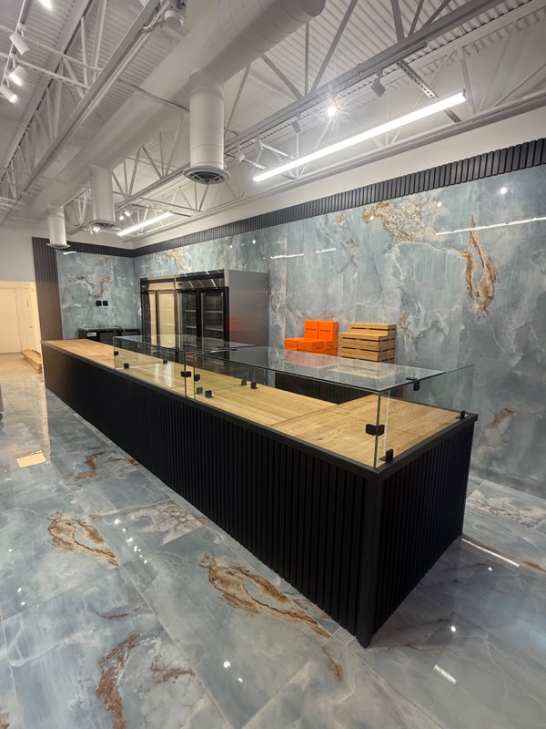 Clear glass display guard on a retail counter