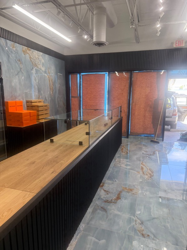 Glass counter guard seen from behind the counter